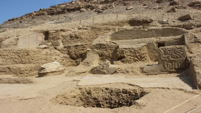 A carving of a human with a bird’s head and a painting were found at the ancient temple. Photo: Peru Ministry of Culture